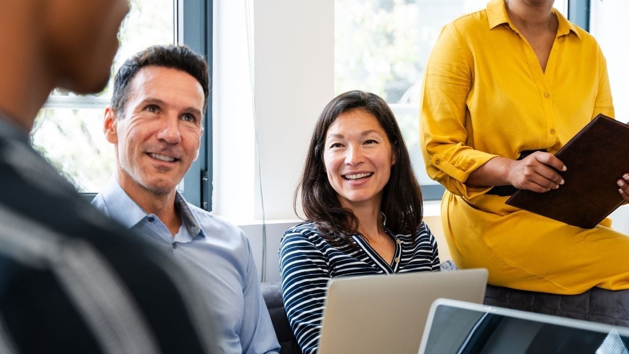 Colleagues in a work meeting discussing new ideas